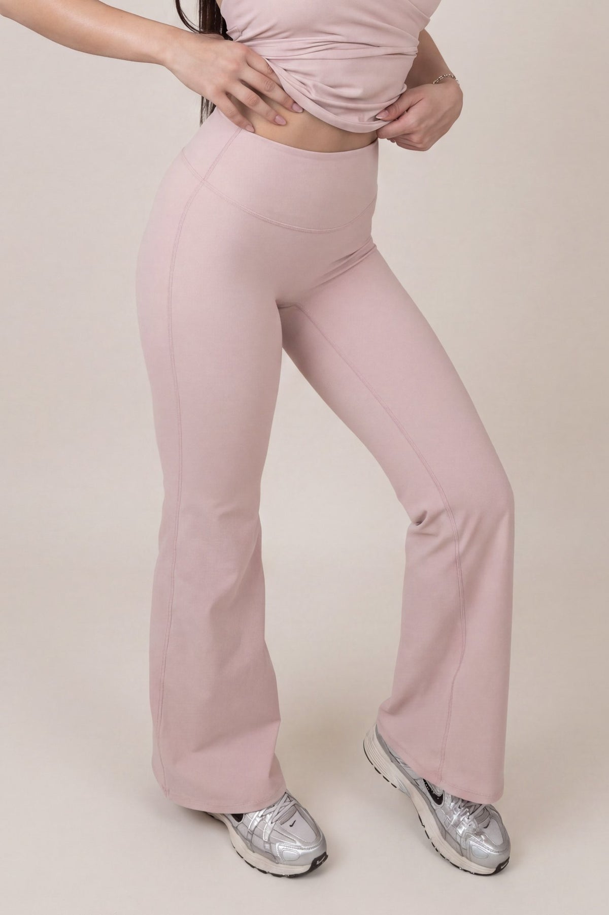 Routine Flared Pants in Ballerina Blush - front waist and flare detail